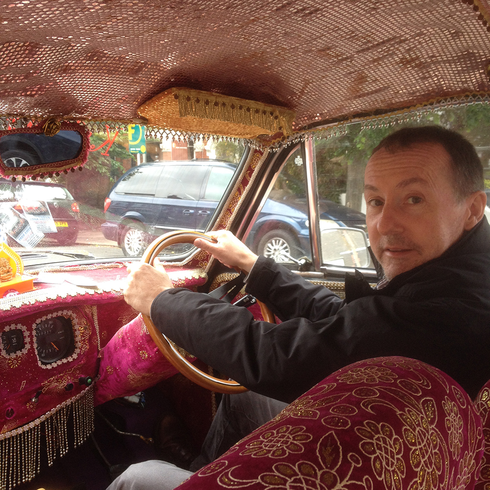 John Evans drives the Hindustan Ambassador