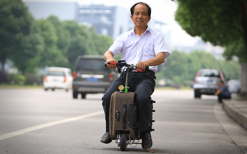 Chinese former farmer creates electric suitcase scooter