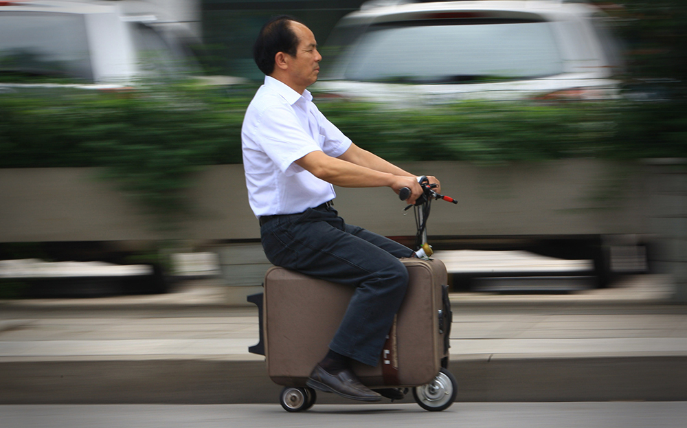 He Liangcai, Chinese former farmer creates electric suitcase scooter