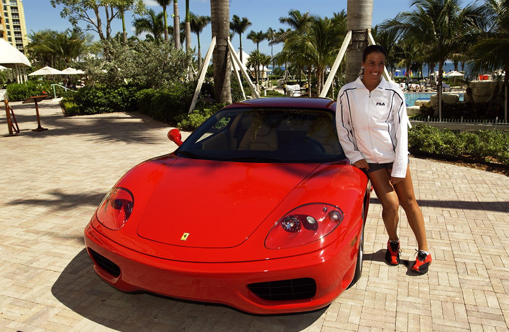Jennifer Capriati of the USA poses with her new Ferrari