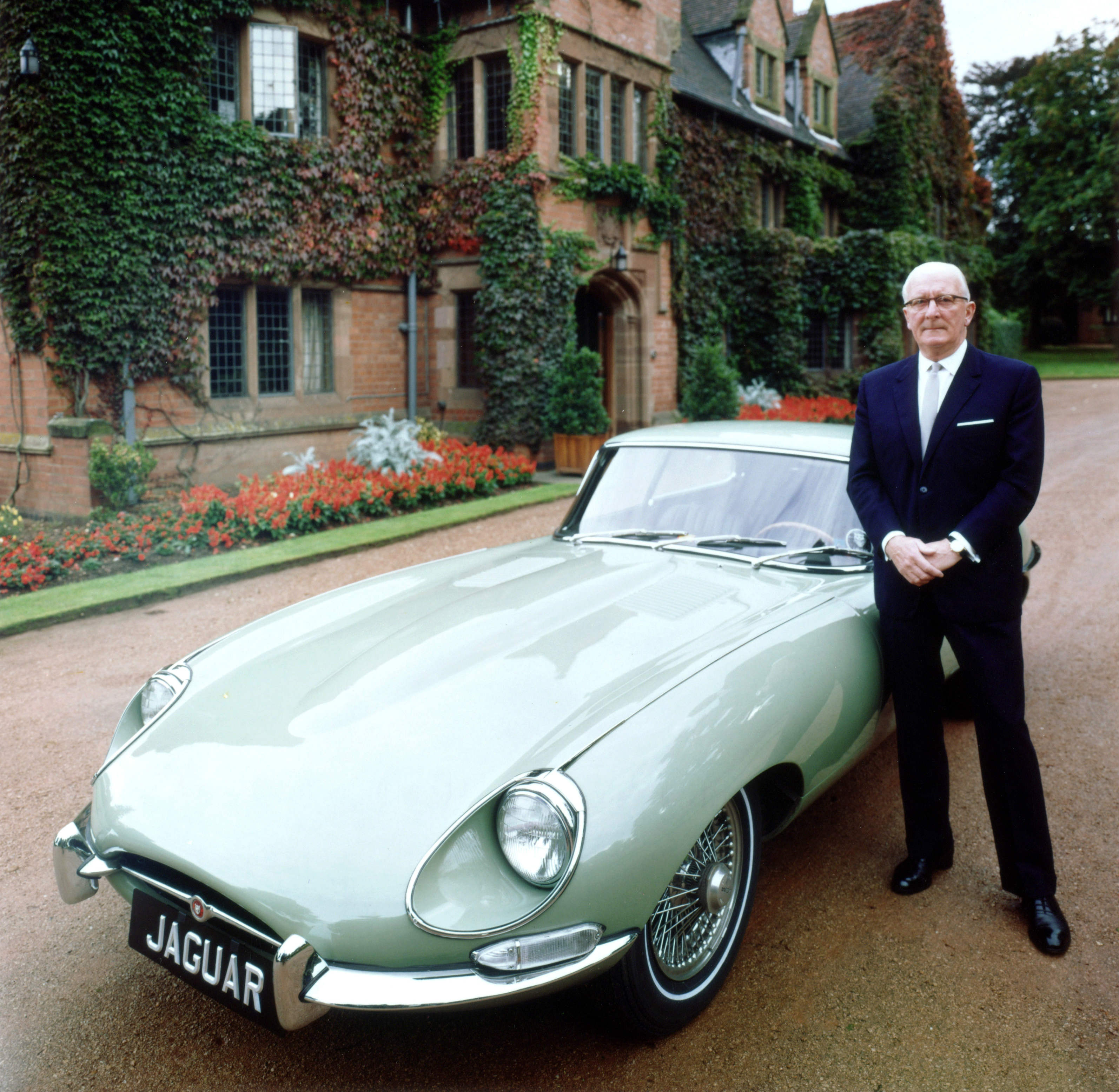 William Lyons with a Jaguar E-type