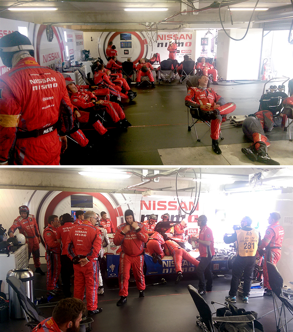 Exhausted mechanics burst into life in the Nissan garage at the 2015 24 Hours of Le Mans