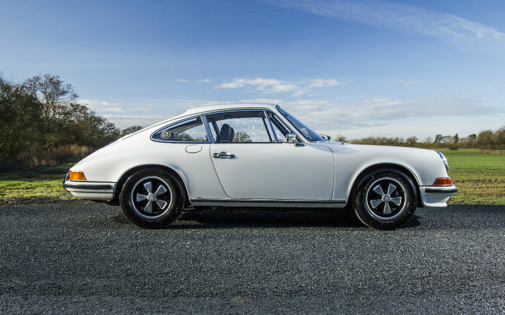 Which car did Porsche develop to replace the 911 in the 1970s?