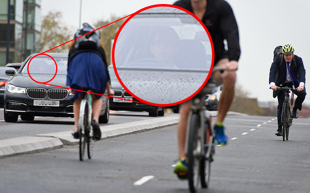 Dominic Tobin drives past London Mayor Boris Johnson on Vauxhall Bridge