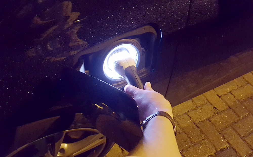 Charging an electric car in the rain