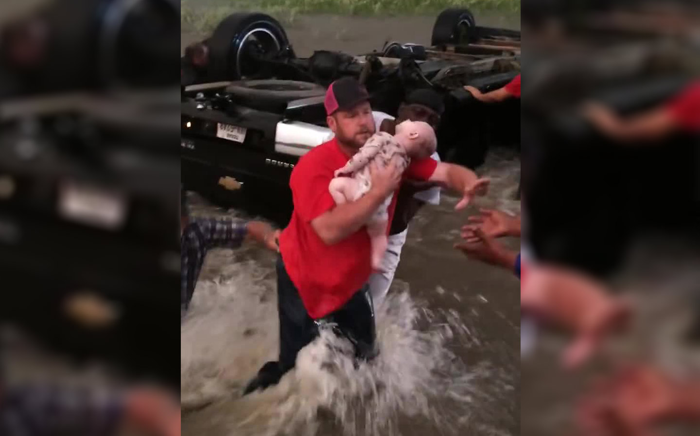 Video: Children saved from overturned car caught in flood water "back home and well"
