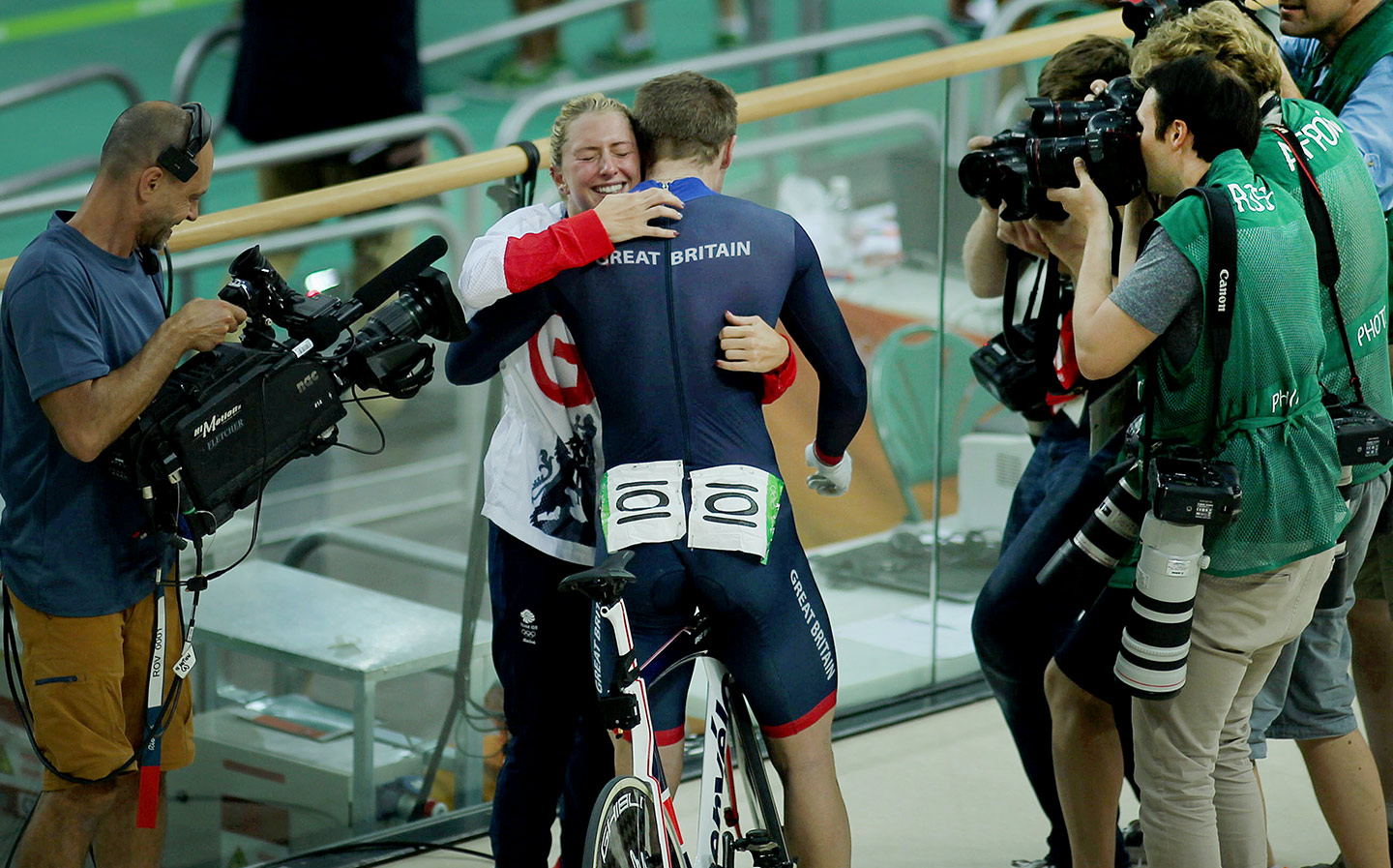 Laura Trott, Kenny's then-fiancee, hugs him after his gold medal ride in the Men's Keirin during the track cycling competition at the Rio Olympic Games, 2016.