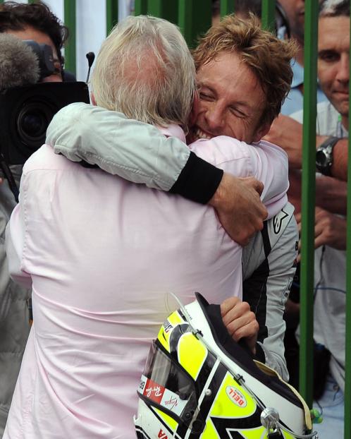 Jenson Button embracing his father after his victory