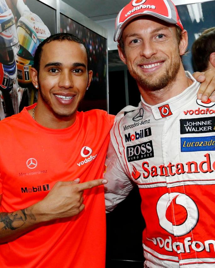 Jenson Button with his former teammate and rival Lewis Hamilton