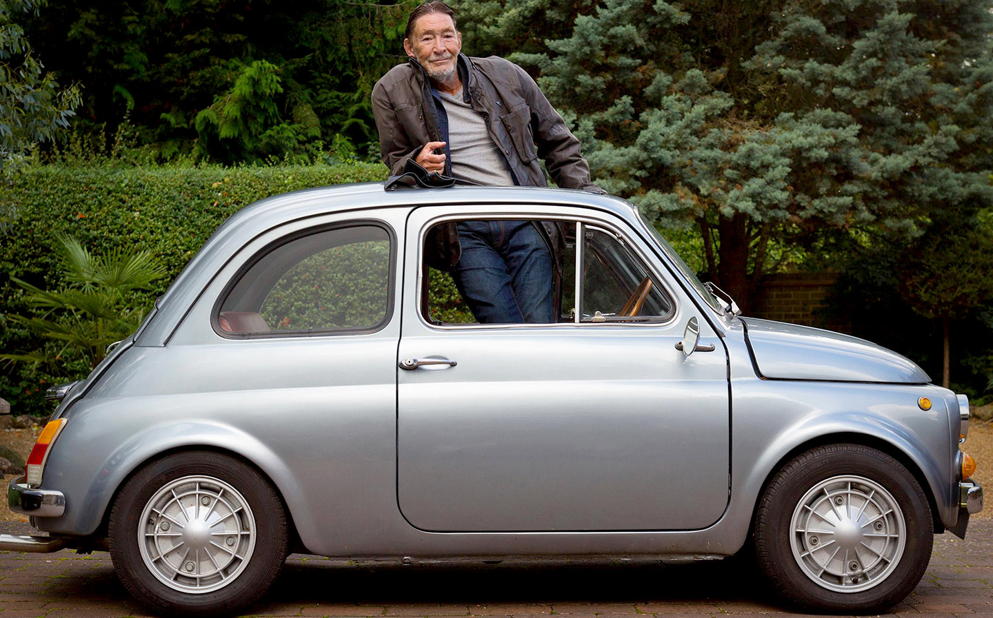 Chris Rea with his Fiat 500. The singer talks about his love of cars, The Road to Hell and his new album.