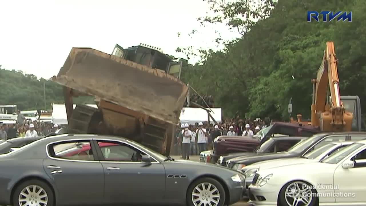 You'll cry when you watch £400,000 worth of sports cars crushed by bulldozer in Philippines