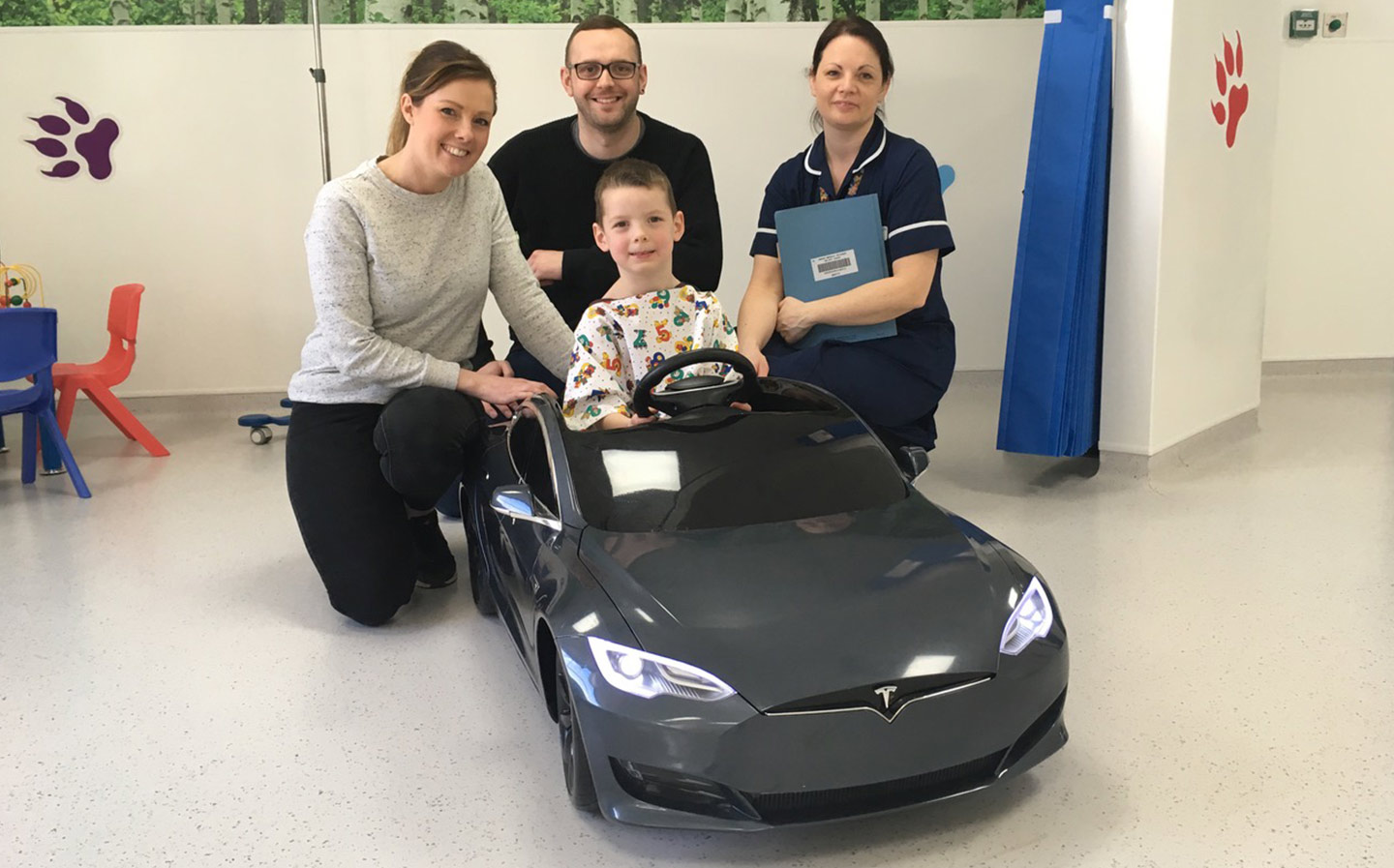 Tesla owner donates ride-on toy so sick children can drive themselves to operating theatre