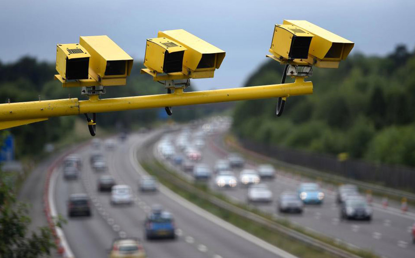 How do average speed cameras work, and does changing lane help avoid speeding fines?