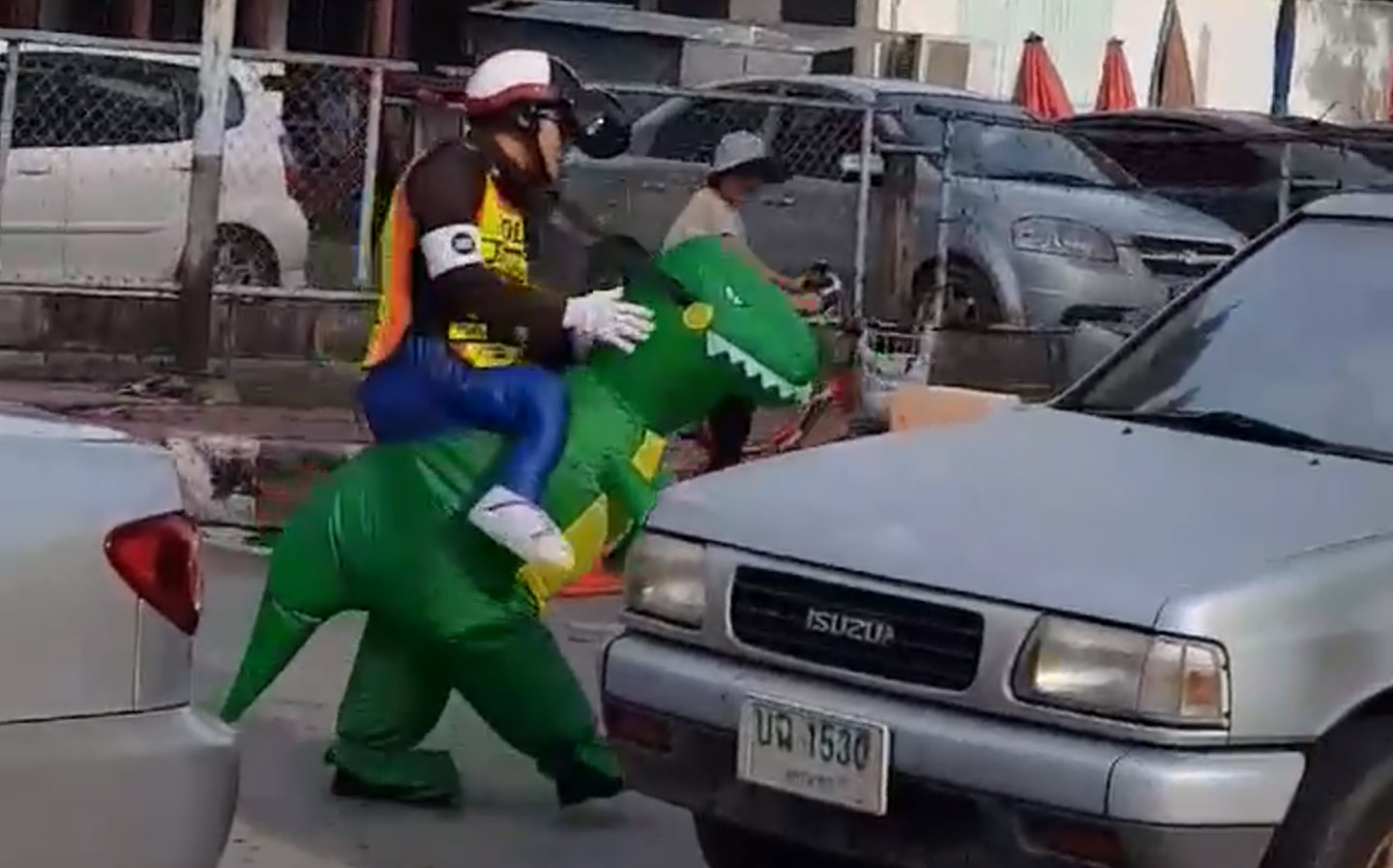 Police officer directs traffic while 'riding' dinosaur