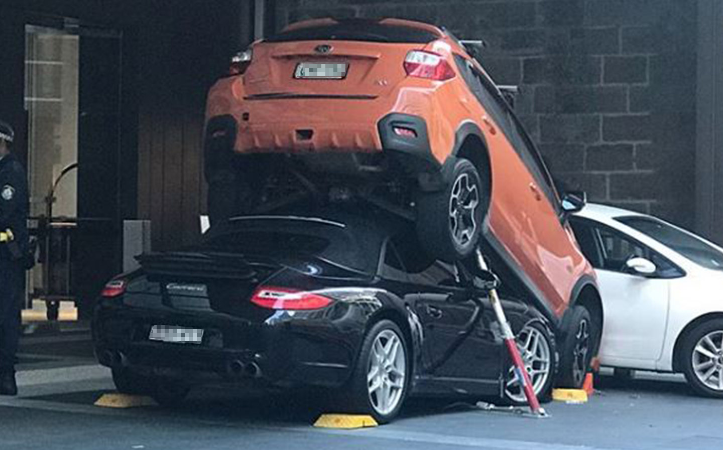 Hotel valet parks a guest's Porsche ... under another car