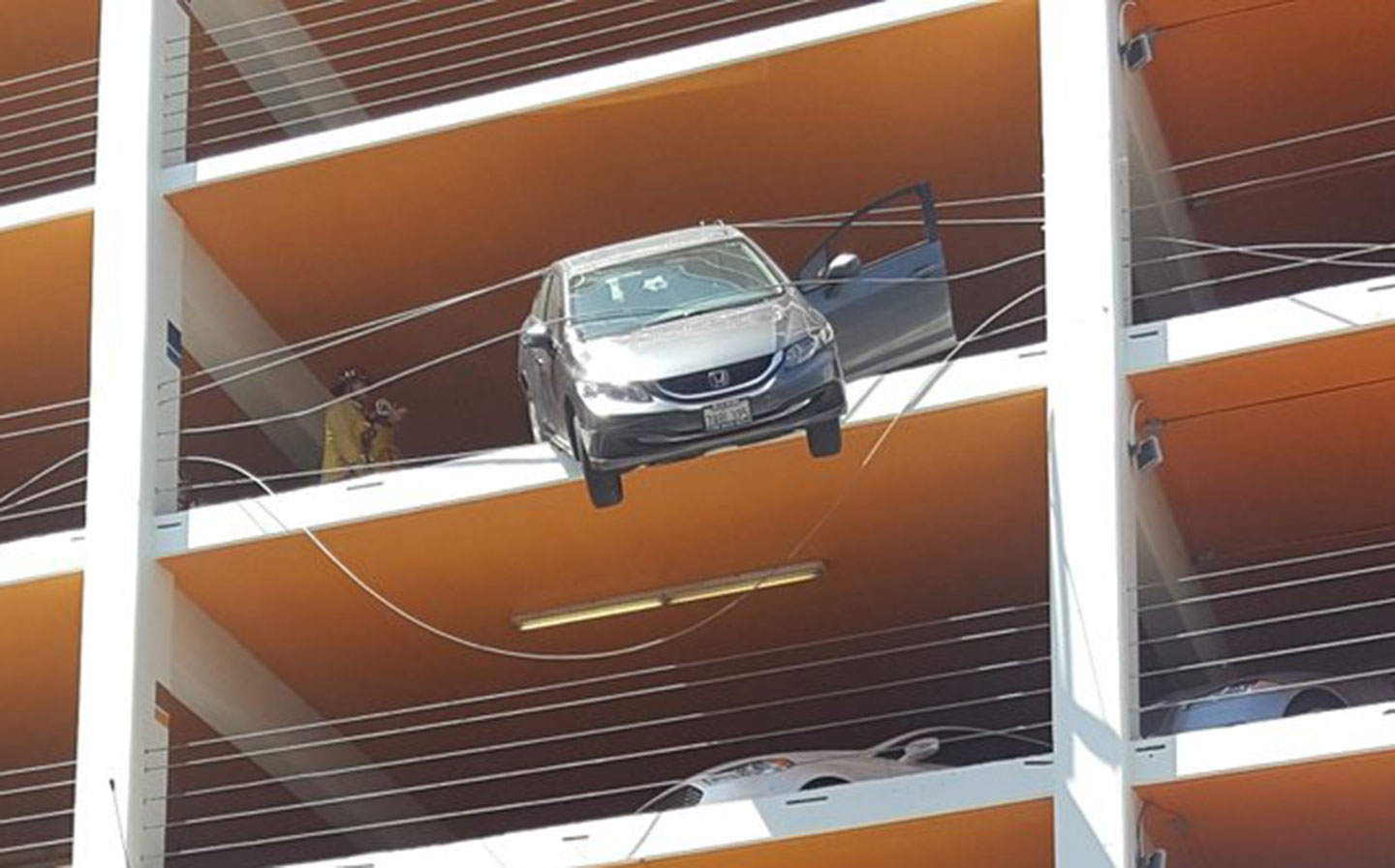 Californian motorist almost drives car off multi-story