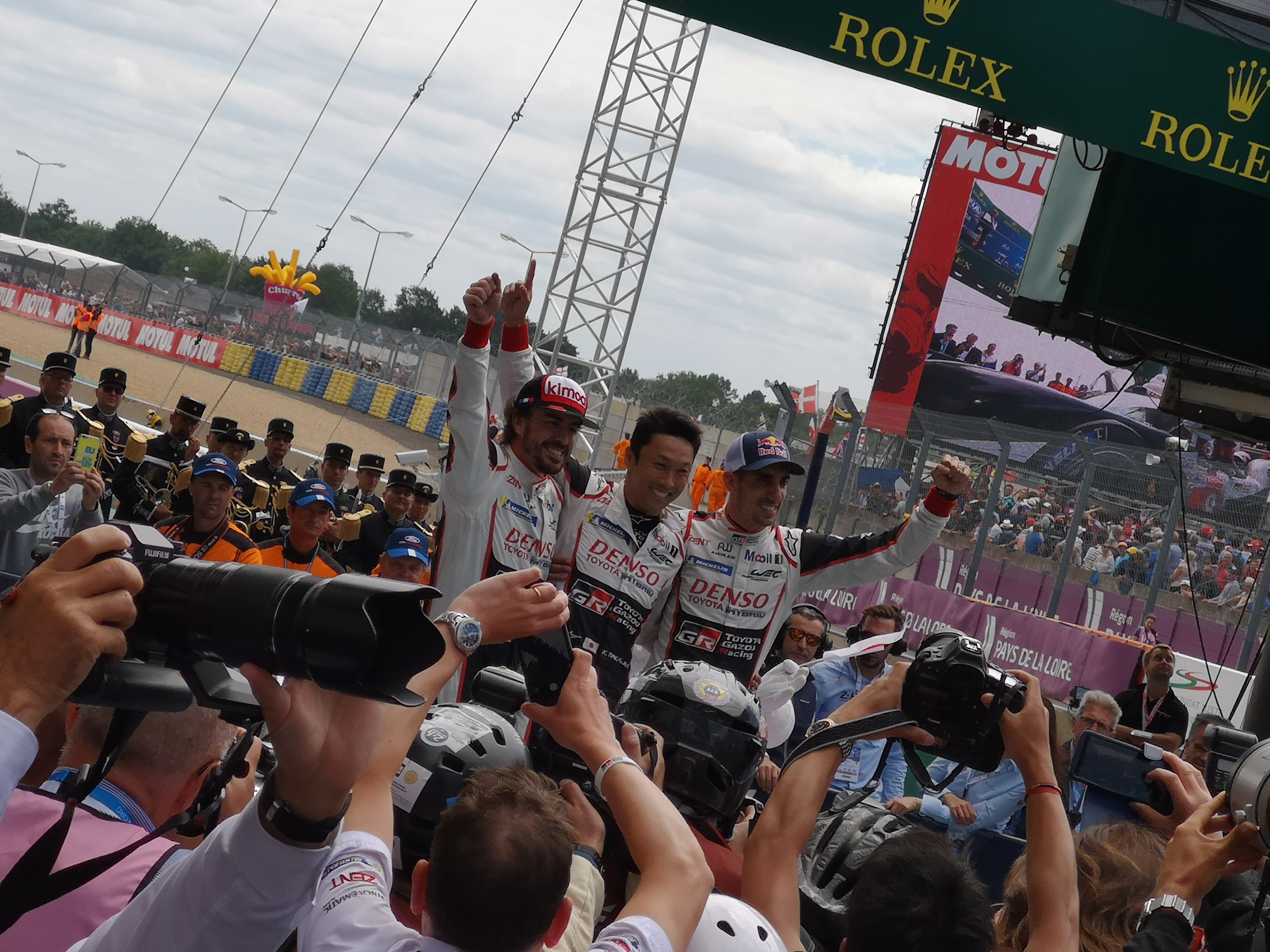 2018 Le Mans 24 Hours - post-race atmosphere in pitlane and podium - Fernando Alonso, Kajuki Nakajima, Sebastien Buemi