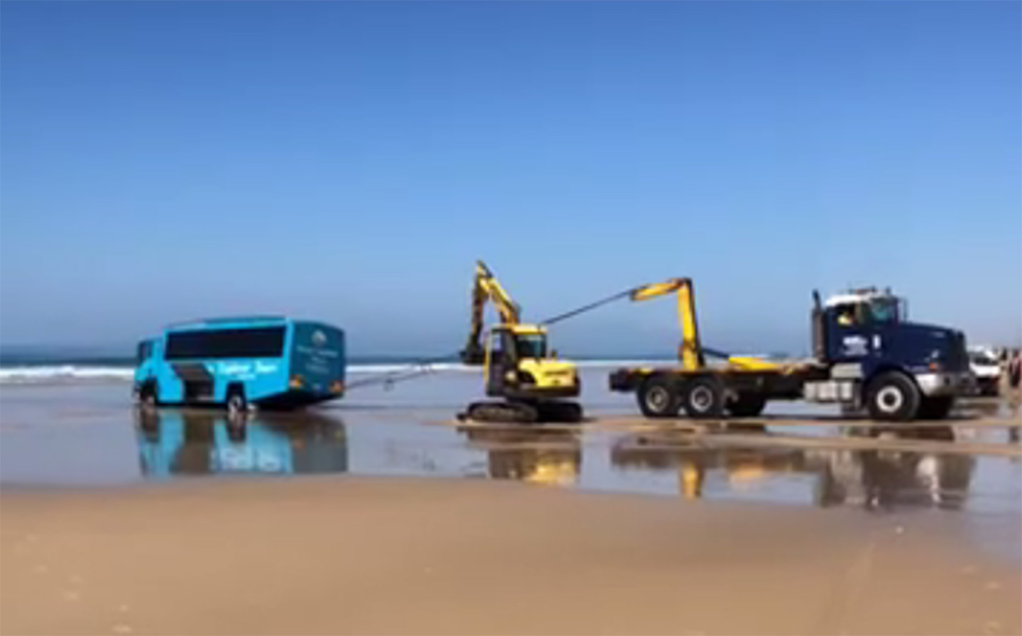Seaplane-rescuing tour bus strands itself on Australian beach