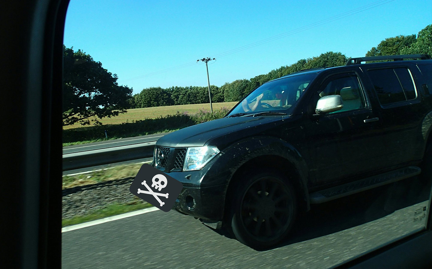 Motorist caught driving on motorway with feet up on dashboard