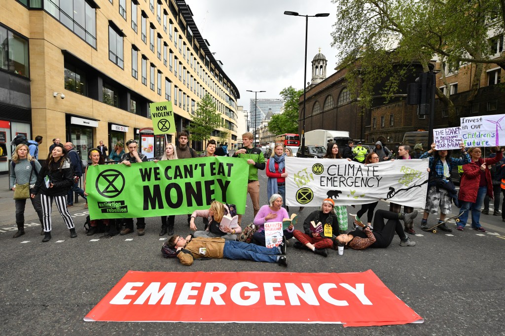 Environmental campaigners from the "Extinction Rebellion" group block a in London as part of protests across the capital in April, 2019.