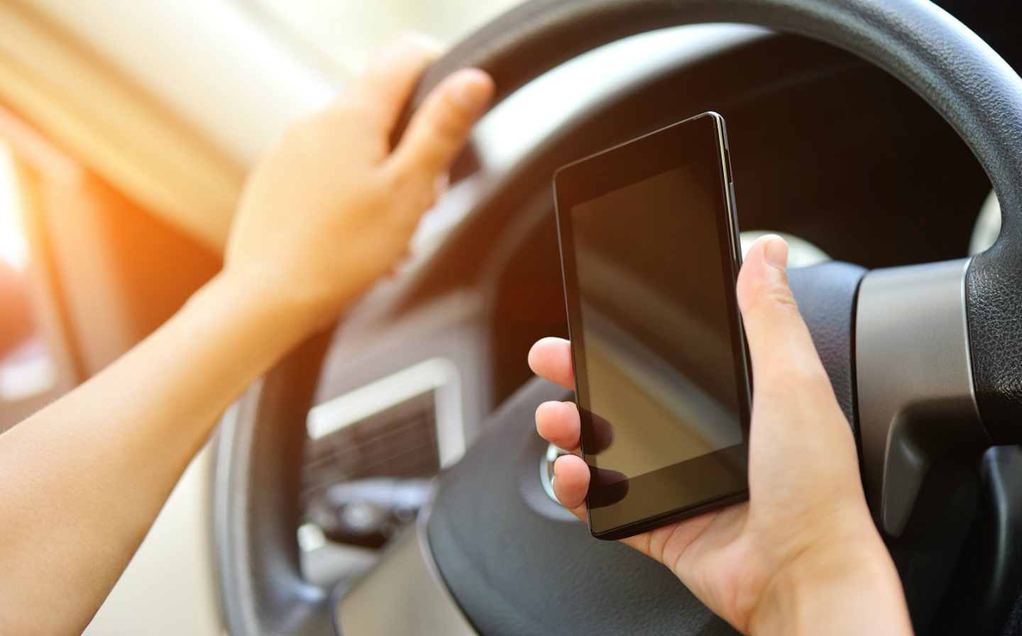 High Court rules it technically isn't illegal to film on a mobile phone while driving