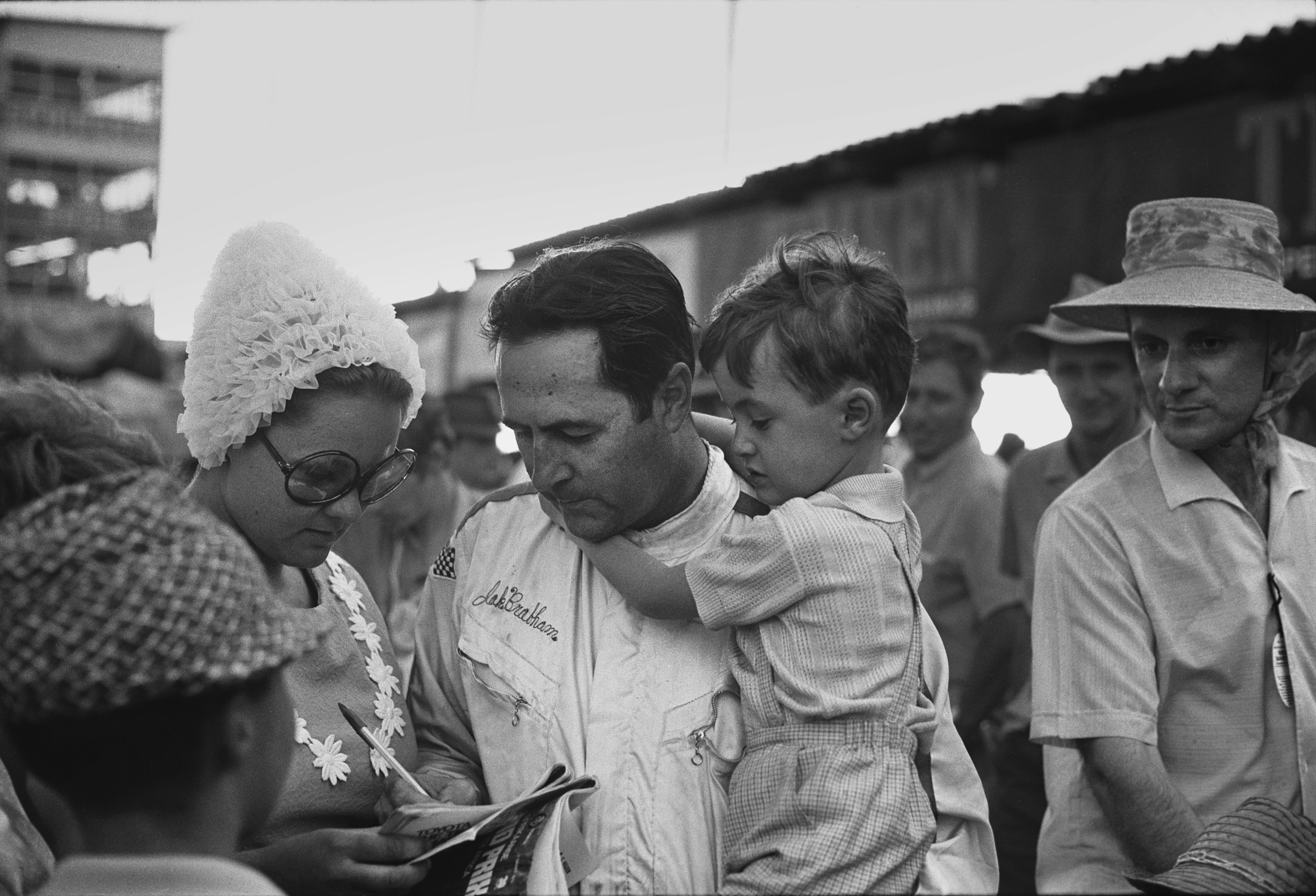 Jack Brabham with son David in his arms, 1970 South African Grand Prix.