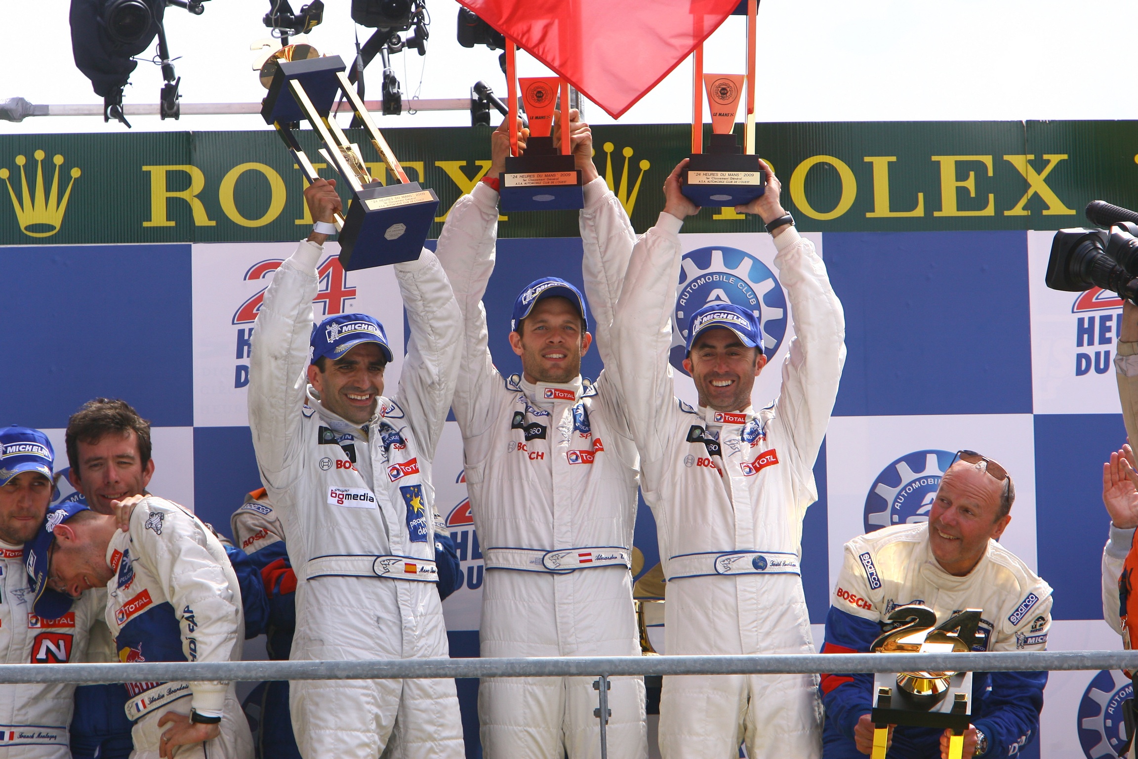 Brabham on the podium after winning the 2009 Le Mans 24 Hours with Peugeot