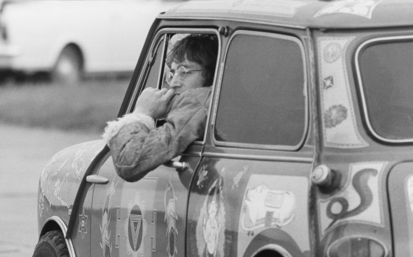John Lennon in his Radford Mini