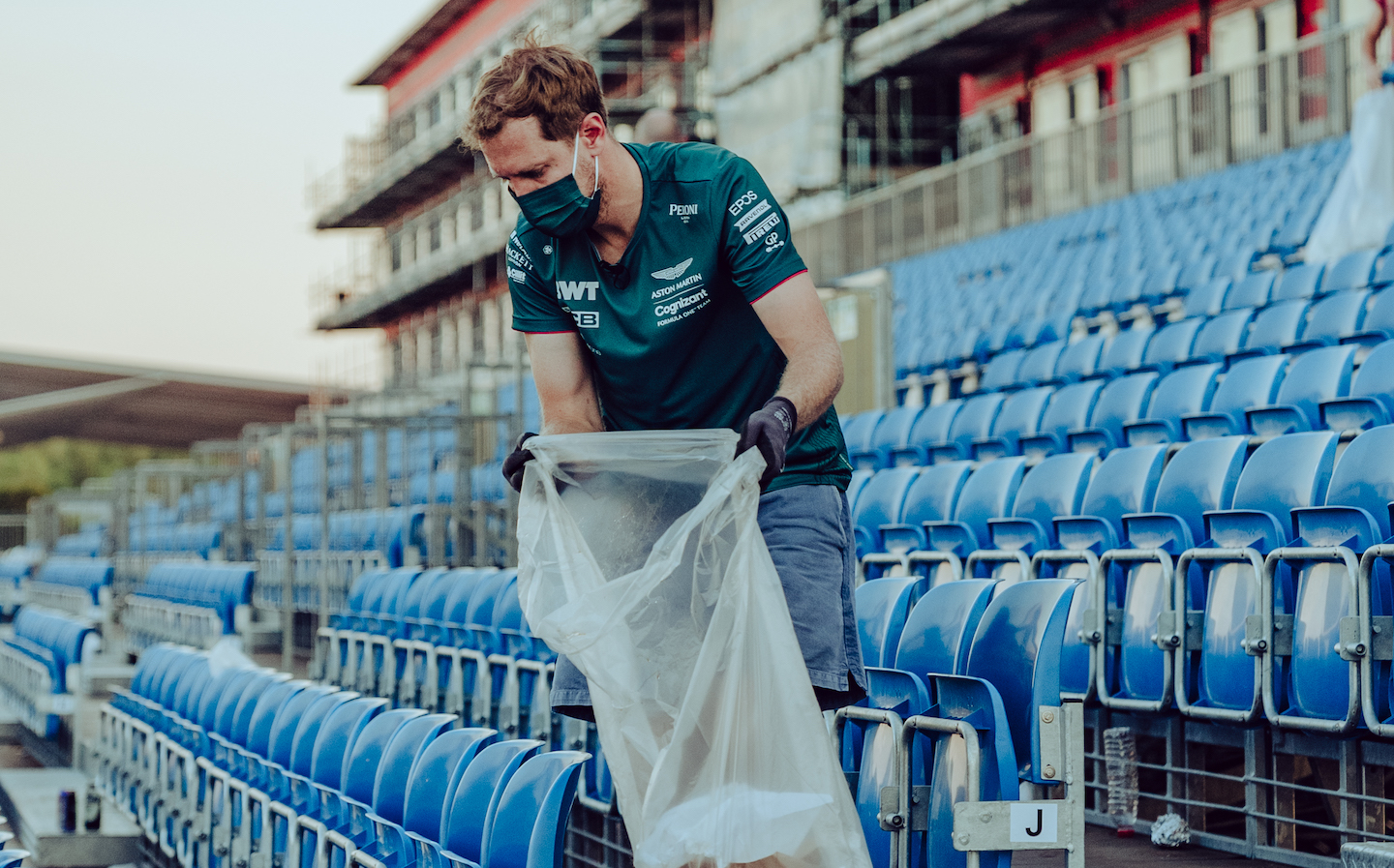 Vettel collecting litter