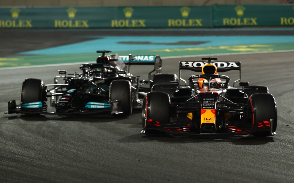 Lewis Hamilton is passed by Max Verstappen on the last lap of the final round of the 2021 F1 World Championship in Abu Dhabi