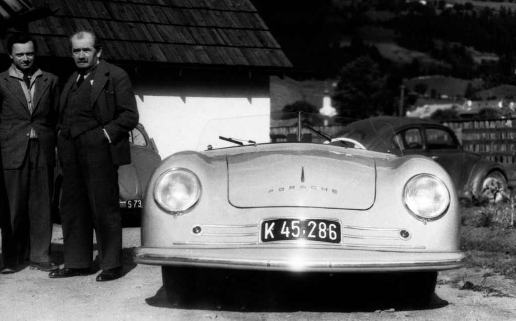Ferdinand Porsche stood near an early 356