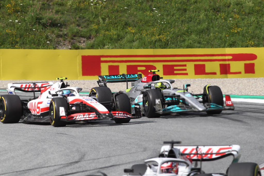 SPIELBERG, AUSTRIA - JULY 09: Lewis Hamilton from Great Britain, Mercedes AMG F1 Team, Mercedes-AMG F1 W13 E Performance driver and Mick Schumacher from Germany, Haas F1 Team, VF-22, F065 engine fight during the F1 Grand Prix of Austria 2022 Sprint Race at Red Bull race track on July 09, 2022 in Spielberg, Austria. (Photo by Arthur Thill ATPImages/Getty Images)