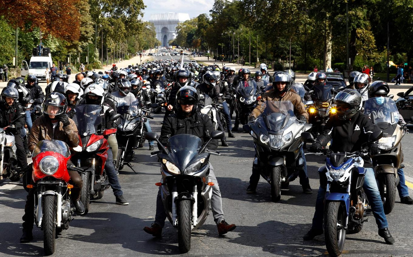 Hundreds of motorcyclists protest Paris parking charges as mayor wages war on motor vehicles