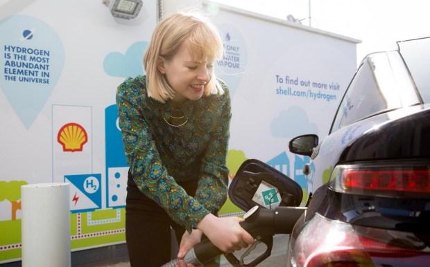 Motorist filling up a hydrogen-fuelled car at a Shell station