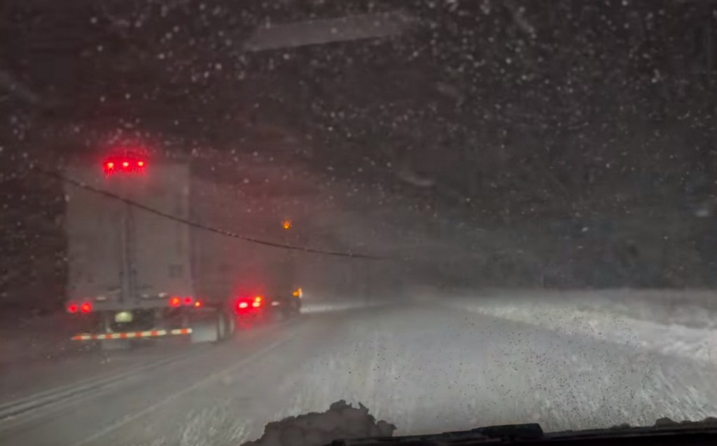 YouTuber Emery Lindeman gets caught out in the snow in his Tesla Model 3.