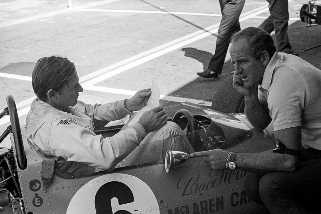 Bruce McLaren and Denny Hulme with the McLaren-Ford M7C at the Grand Prix of Mexico, October 1969. (Photo by Bernard Cahier/Getty Images)