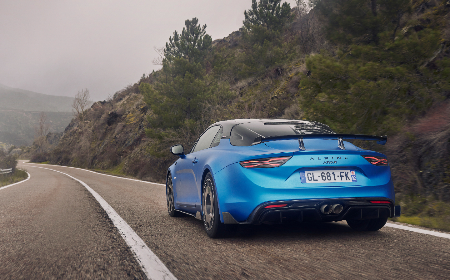 Alpine A110 R on the road, rear shot, action