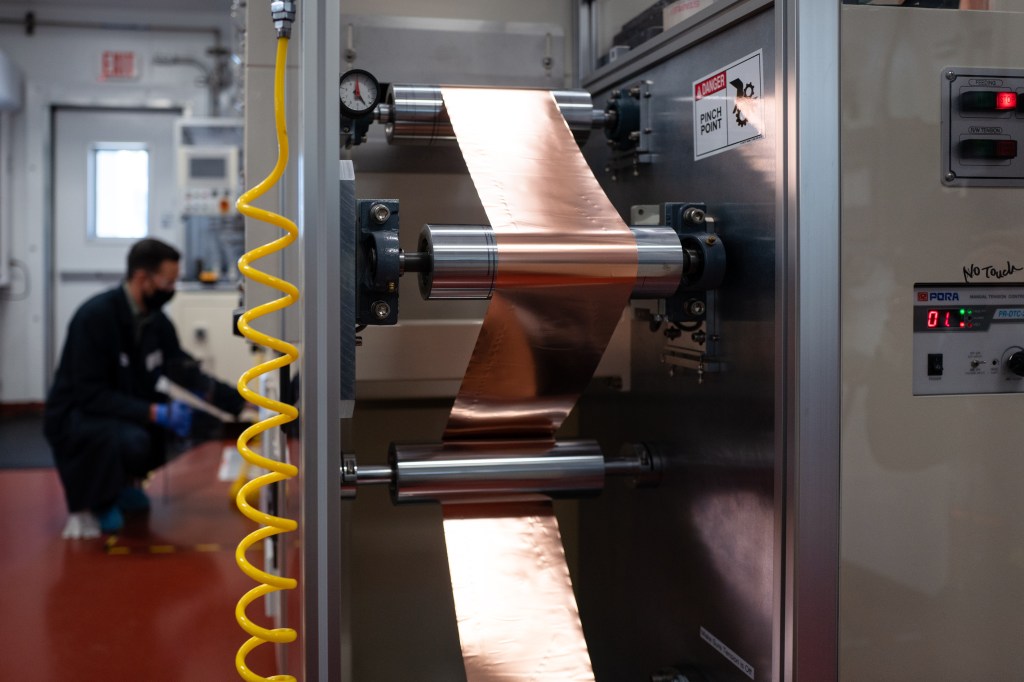 A roll of thin copper containing a slurry mixture moves throughout a machine that creates battery cells at the Albermarle facility in Kings Mountain, North Carolina, US, on Wednesday, Aug. 10, 2022. Albemarle Corp. wants to restart a lithium mine as the building block of the first complete EV battery supply chain in the US. Photographer: Logan Cyrus/Bloomberg via Getty Images