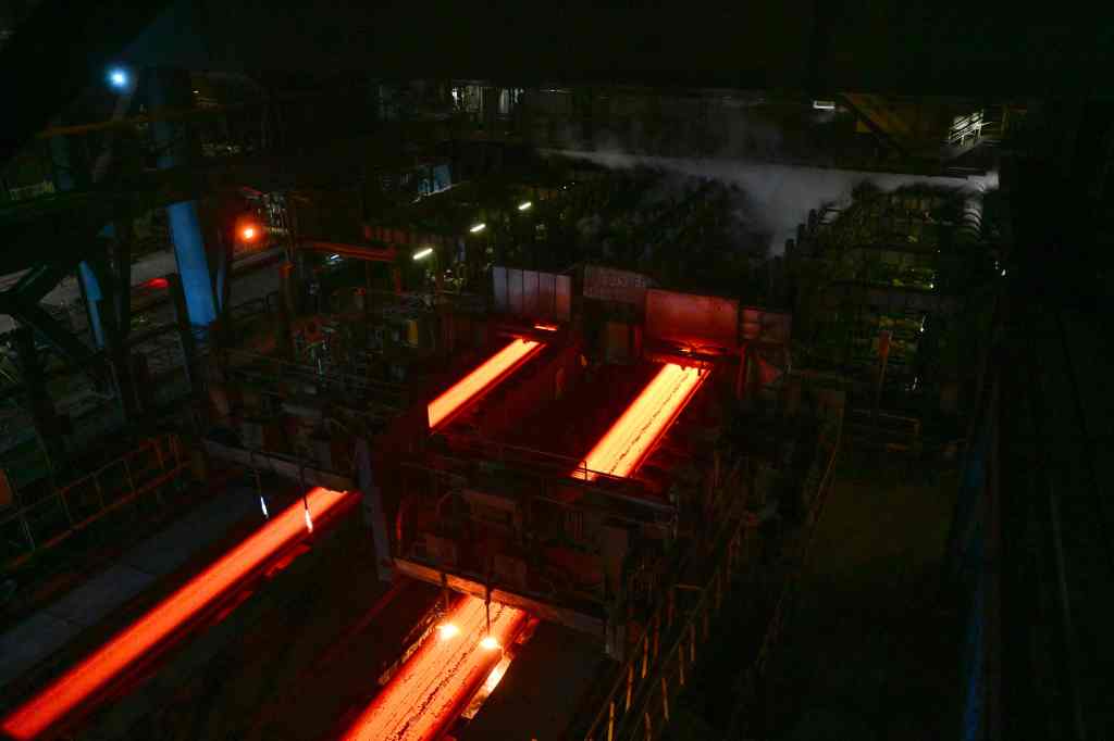 This photograph taken on February 22, 2023, shows a part of the steel production line inside of the steelwork site of an ArcelorMittal factory, as the site goes through a plan to reduce its carbon footprint (CO2) up to 35 percent for 2030, in Fos sur mer. - ArcelorMittal will reoperate one of the two blast-furnaces that was stopped at the end of 2022 due to the reduction in steel demand and the impact of rising energy prices, announced the site's director on February 22, 2023. (Photo by Christophe SIMON / AFP) (Photo by CHRISTOPHE SIMON/AFP via Getty Images)