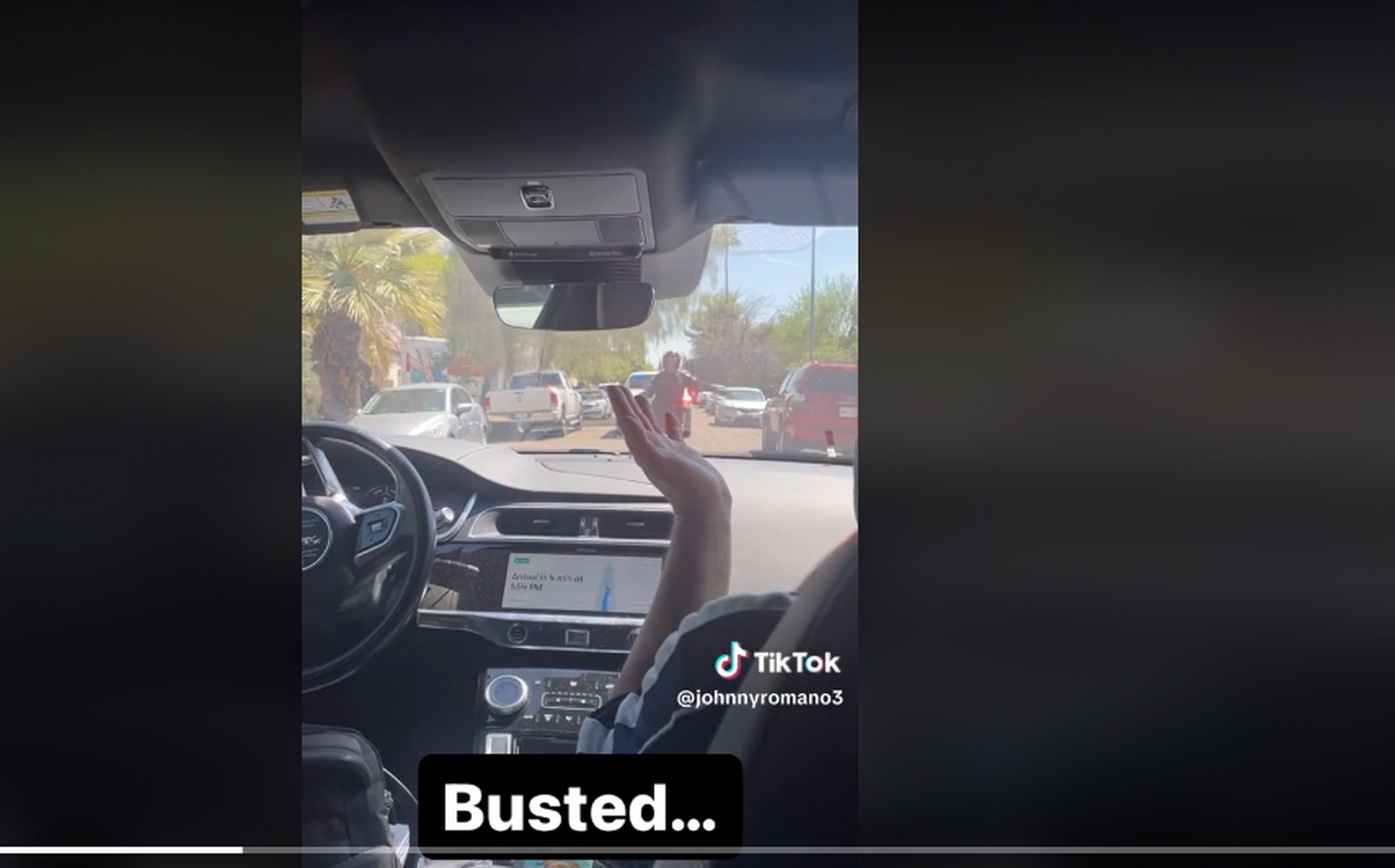 TikTok user @johnnyromano3 captures moment Waymo robotaxi is confused by traffic cop in America