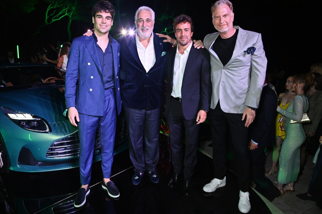 CAP D'ANTIBES, FRANCE - MAY 24: (L to R) Lance Stroll, Lawrence S. Stroll, Executive Chairman of Aston Martin,, Fernando Alonso and Marek Reichman, Executive VP & Chief Creative Officer of Aston Martin, attend the launch of the new Aston Martin DB12 at the Hotel du Cap-Eden-Roc in Antibes on May 24, 2023 in Cannes, France. Billed as The World's First Super Tourer, DB12 was unveiled ahead of Aston Martin's presenting sponsorship of the amfAR Gala Cannes. (Photo by Dave Benett/Getty Images for Aston Martin)