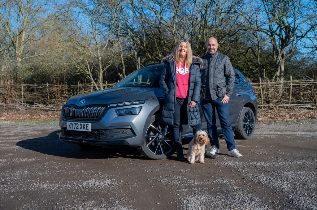 Tina Milton with husband Rob and cavapoo dog Jessie by the 2022 Skoda Kamiq Monte Carlo