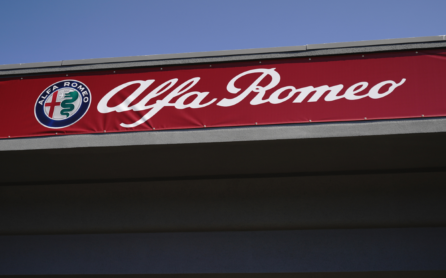 Alfa Romeo logo on a dealership