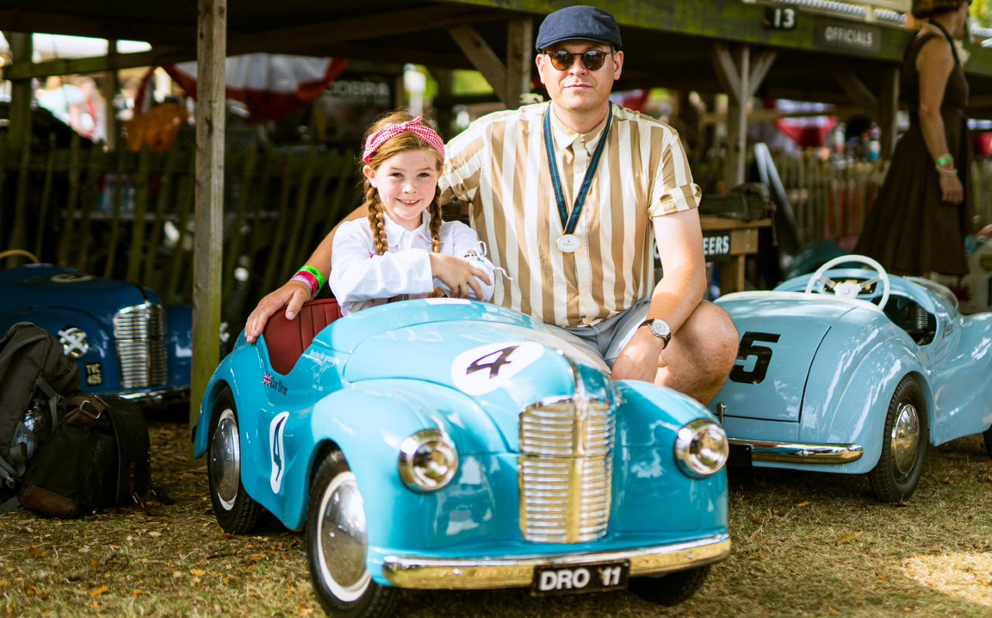 Eva and Will Dron pose by their Austin J40 ahead of the Settrington Cup 2023
