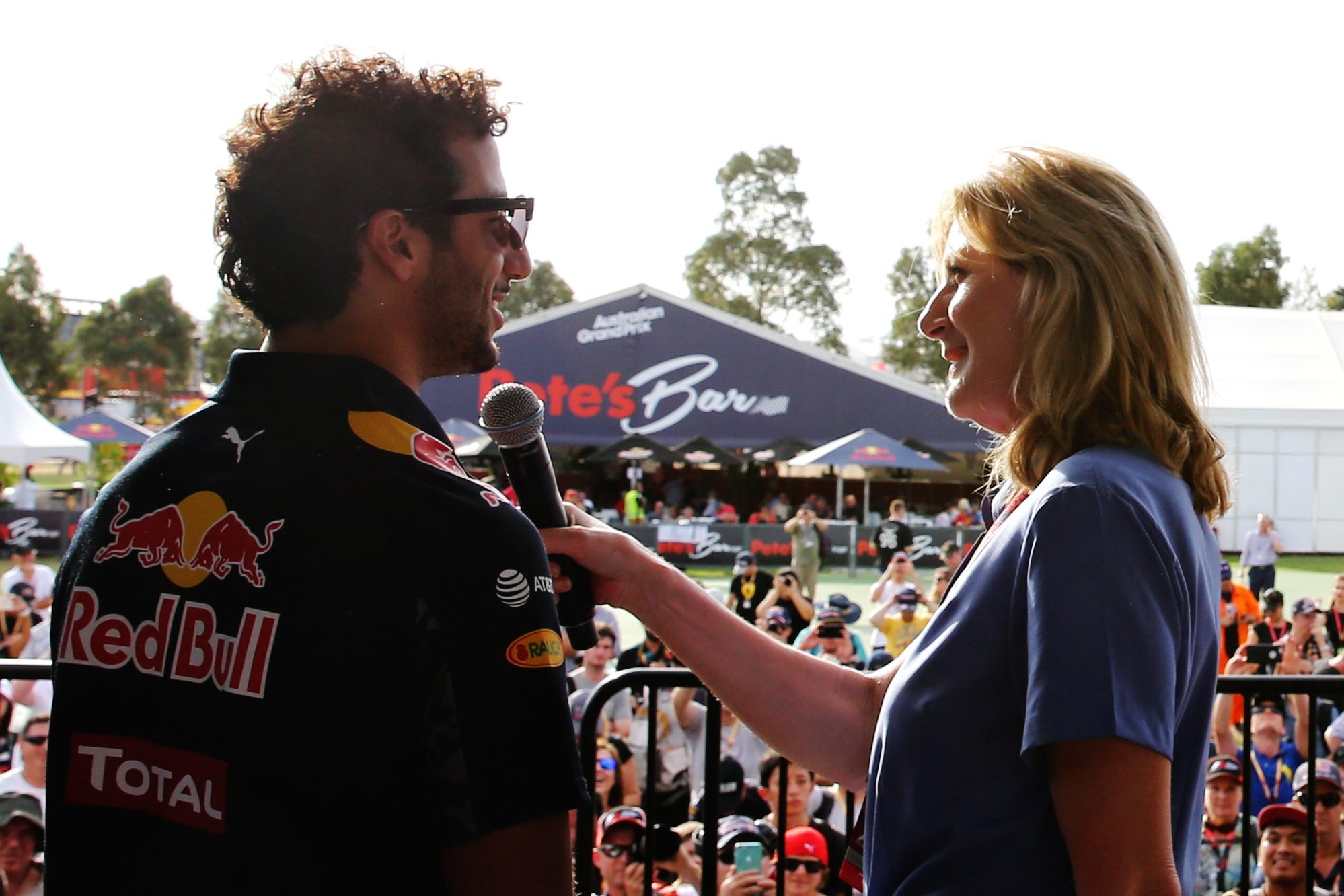 MELBOURNE, AUSTRALIA - MARCH 17: Daniel Ricciardo of Australia and Red Bull Racing and Daniil Kvyat of Russia and Red Bull Racing talk to Louise Goodman and fans on stage during previews to the Australian Formula One Grand Prix at Albert Park on March 17, 2016 in Melbourne, Australia.  (Photo by Mark Thompson/Getty Images)