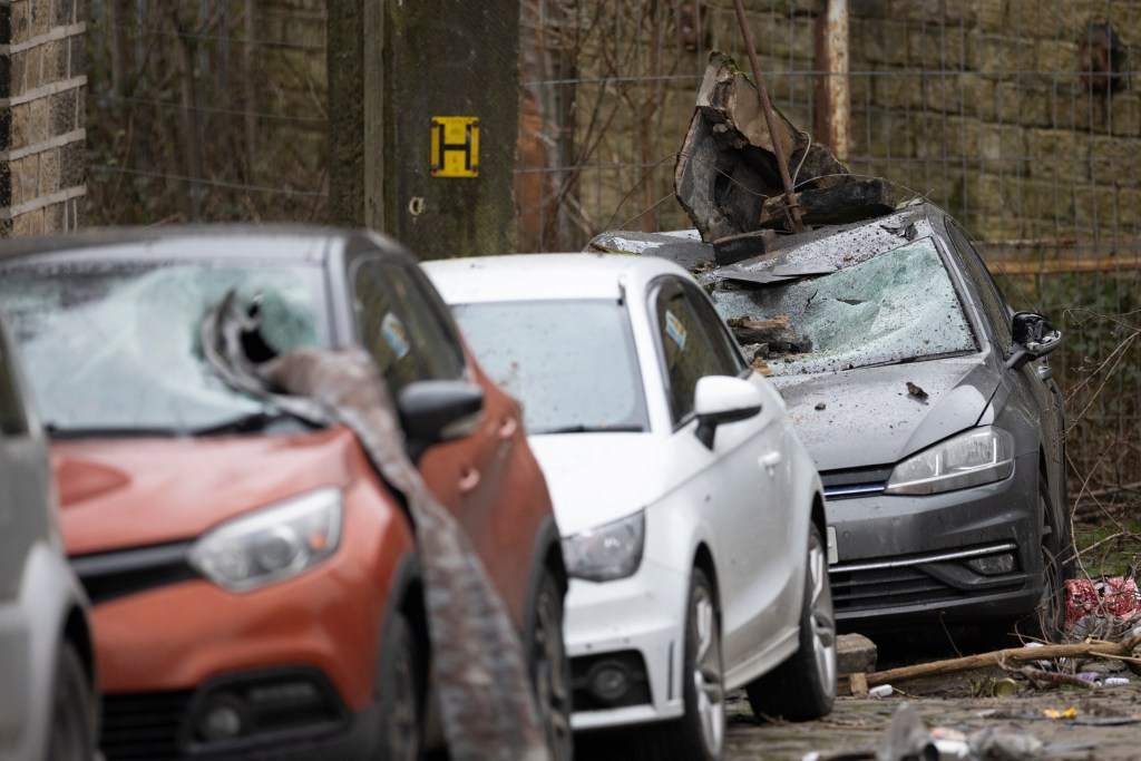 Cars damaged by debris from a storm