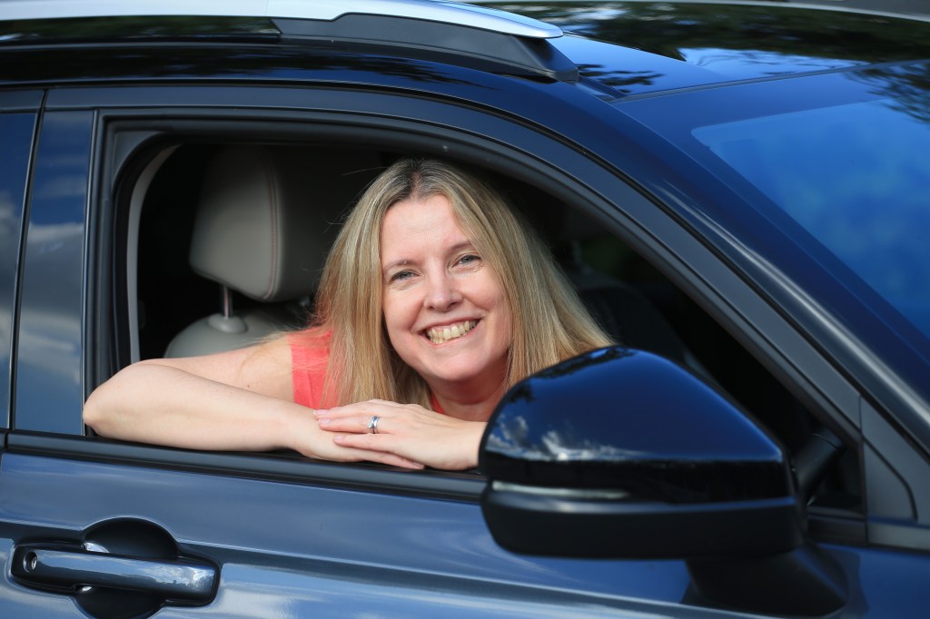Tina Milton leans out of Honda HR-V window
