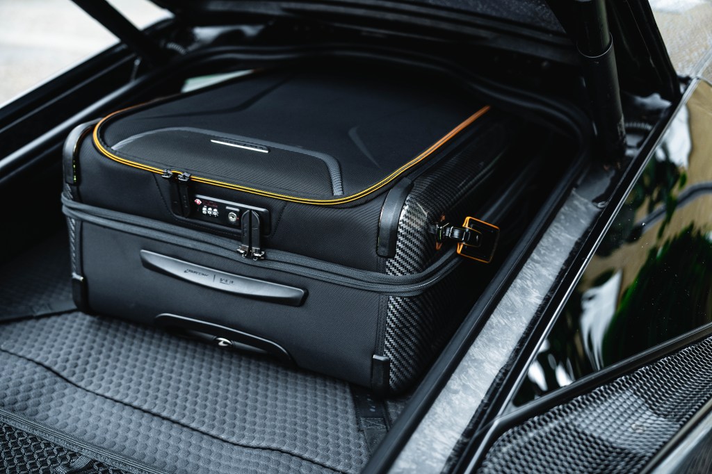 McLaren GT boot with suitcase.