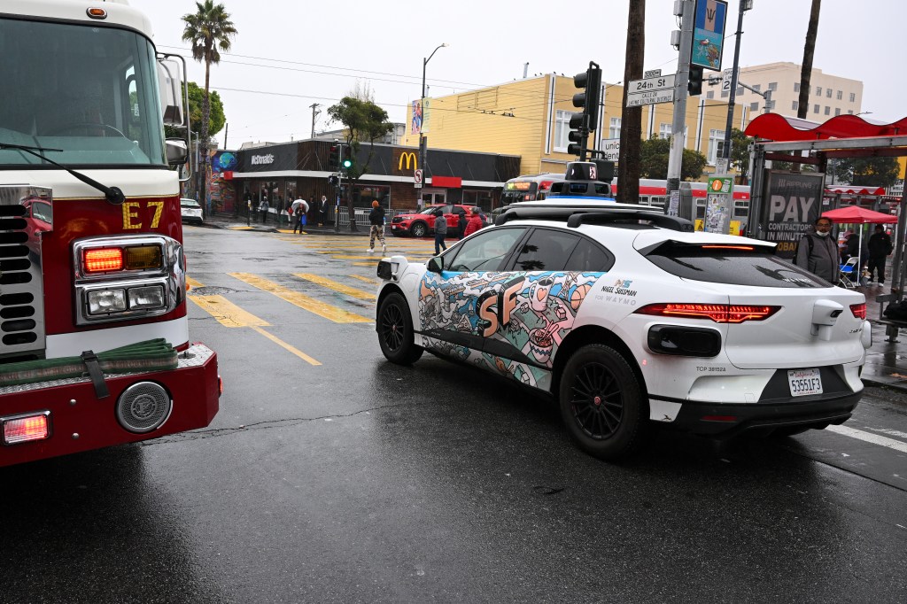 SAN FRANCISCO, CALIFORNIA - DECEMBER 18: A driverless car Waymo is seen during rainy weather in San Francisco, California, United States on December 18, 2023. (Photo by Tayfun Coskun/Anadolu via Getty Images)