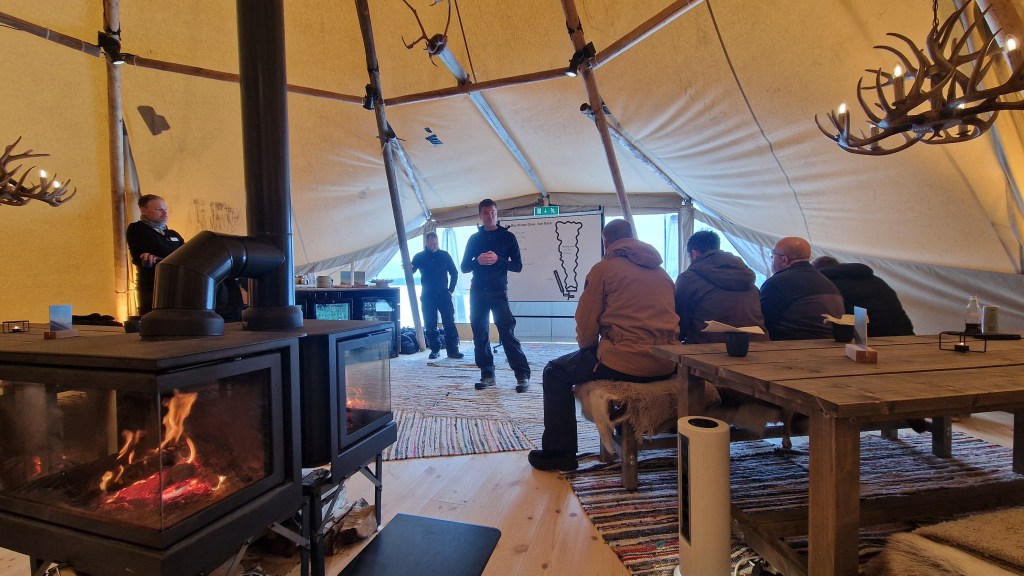 Volvo Winter Drive ice driving course media briefing in a tent.